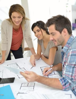 Workteam of architects meeting in office