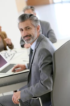 Portrait of architect meeting with clients in office