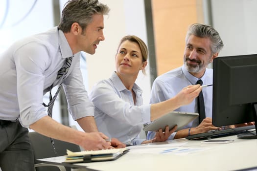 Business team working on project in office