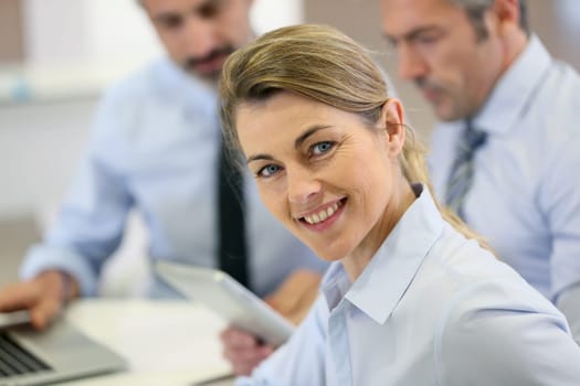 Smiling businesswoman attending work meeting