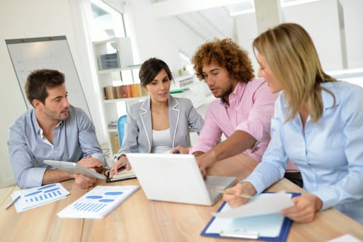 Business people meeting around table