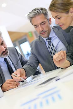 Business people working on budget strategy