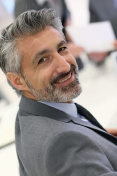 Portrait of mature businessman with grey hair