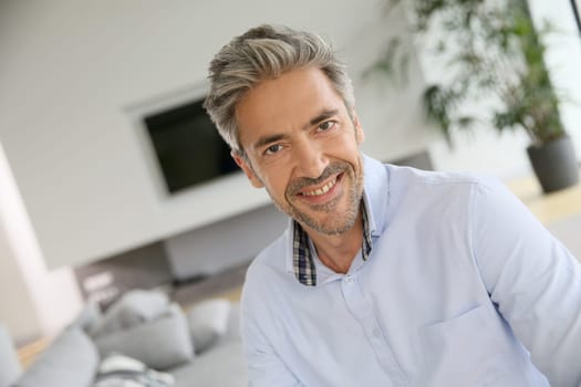 Portrait of handsome mature man with blue shirt