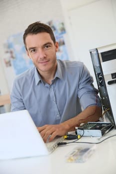 Engineer proceeding to data recovery from computer