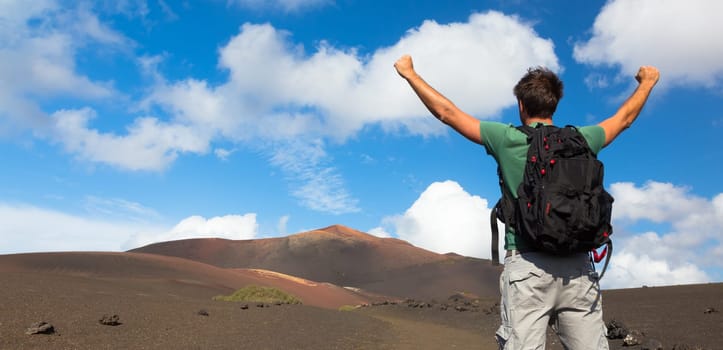 Man can see the peak of volcano, nearly made it to top. Concept of success. Made it. Cloce to reaching the goal.