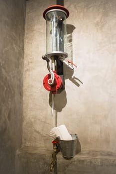 Vintage water tap decotated on grey wall, stock photo