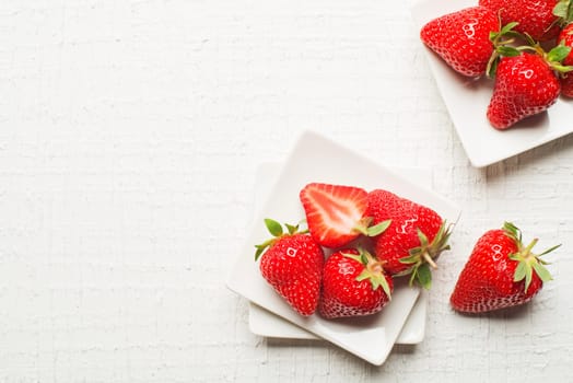 Fresh red Strawberries fruits on a white background.