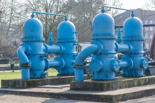 Old industrial machine,water turbine on a concrete base.