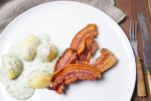 Denmark&#39 s national dish fried pork belly with parsley sauce and potatoes