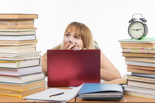Student shocked looking at books