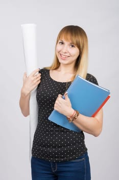 The joyful girl with a roll of drawings and a folder in hands