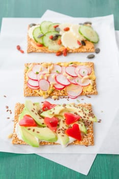 Knaeckebrot with colorful spread and topping