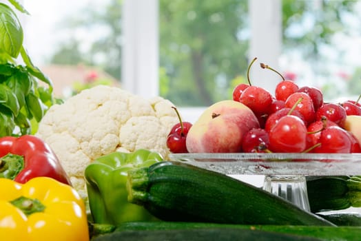 an assortment of fresh vegetables and fruits