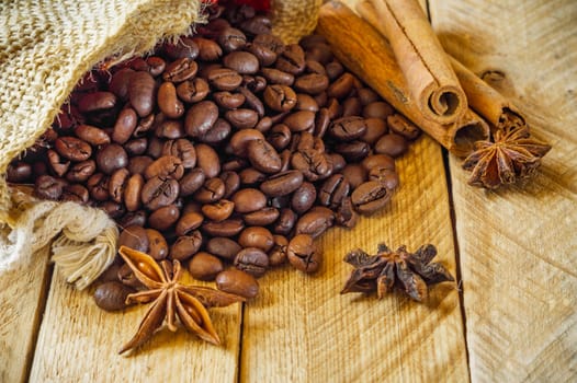 Close-up of coffee beans with star anise and cinnamon.