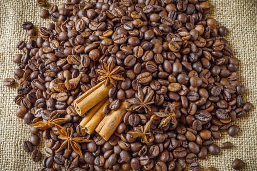 Close-up of coffee beans with star anise and cinnamon.