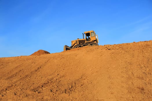 Image of rural landscape with agricultural machine