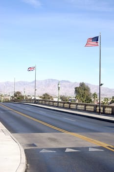 The London Bridge in Lake Havasu City,recreated by Robert P. McCulloch,with waving English and American flags.