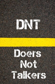 Concept image of Business Acronym DNT Doers Not Talkers written over road marking yellow paint line