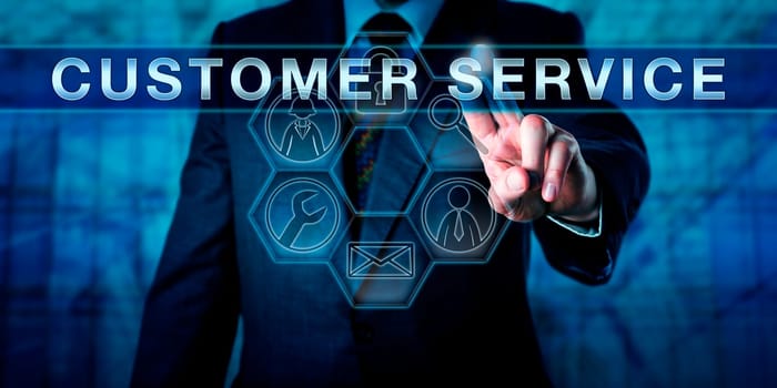 Business man pushing CUSTOMER SERVICE on an touch screen display. Business metaphor and technology concept. Closeup on male torso interacting with a virtual interface with fingers of his left hand.