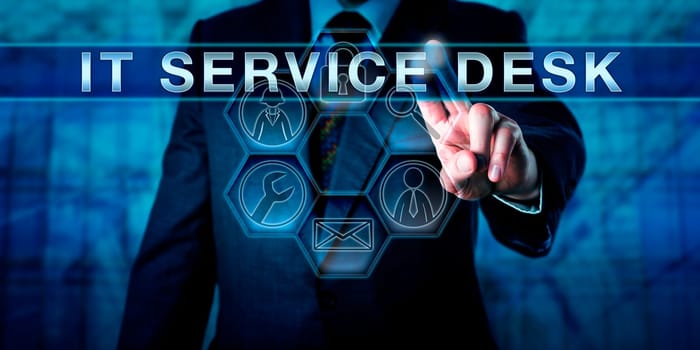 Torso of corporate client is pushing IT SERVICE DESK on a virtual touch screen display. Business metaphor and information technology concept for professional support in the service industry.