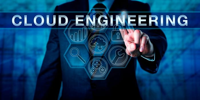 Cloud architect is pressing CLOUD ENGINEERING on an interactive touch screen display. Business metaphor and information technology concept for an engineering approach to cloud computing.