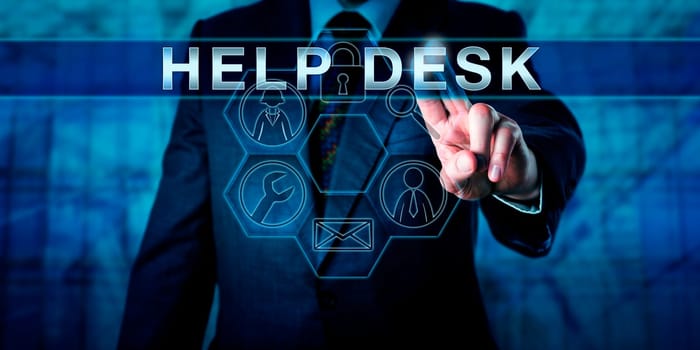 Business person is pressing HELP DESK on a virtual interactive touch screen interface. Business metaphor and information technology concept. Service icons do light up in a hexagonal control matrix.
