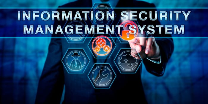 Male enterprise data manager is touching INFORMATION SECURITY MANAGEMENT SYSTEM on a virtual interactive control monitor. Business metaphor, IT and data security concept, abbreviated as ISMS.