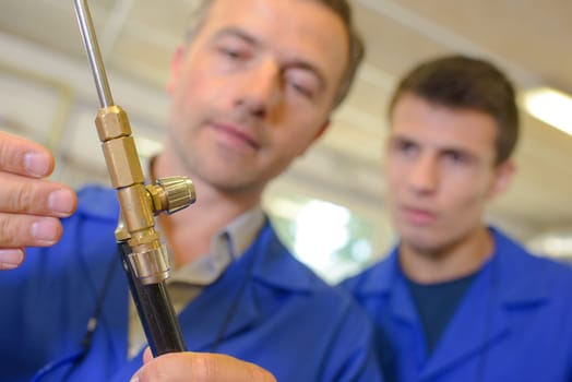 Man adjusting gas burner