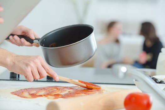 Man preparing a tomato sauce