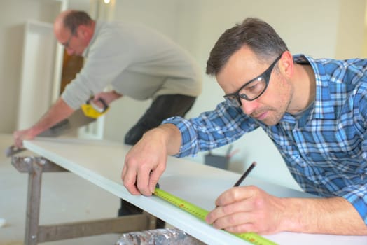 Measuring plank of wood