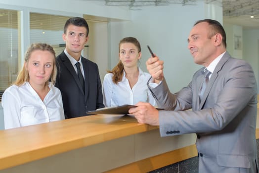 Hotel staff following supervisor's gaze