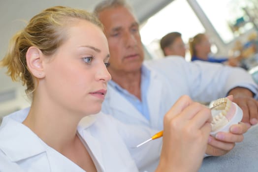 woman making dentures