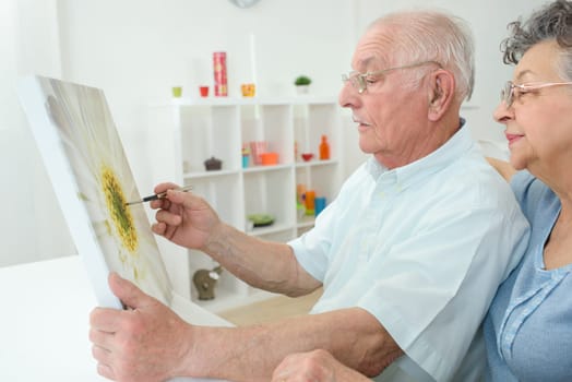 old man painting