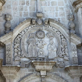 AREQUIPA, PERU - AUGUST 22, 2014: Detail of the artwork on the facade of the San Francisco church and convent on Zela Street on August 22, 2014 in Arequipa, Peru. The city center of Arequipa is an UNESCO World Cultural Heritage Site.
