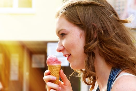 Young woman eating ice cream
