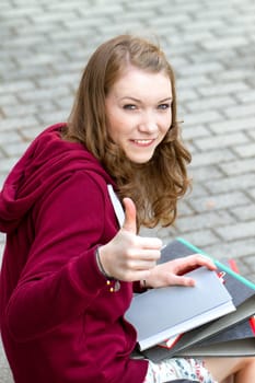 Schoolgirl with thumbs up