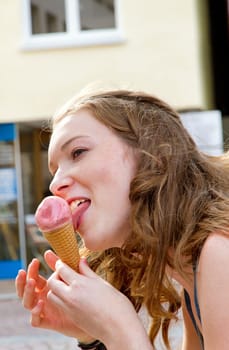 Young woman eating ice cream