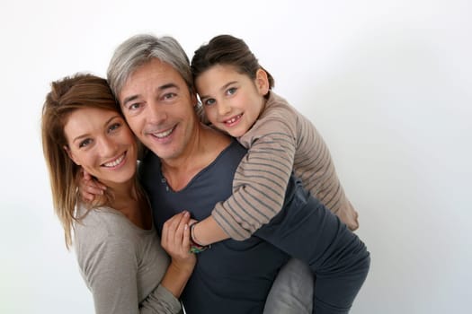 Happy family of three standing on white background