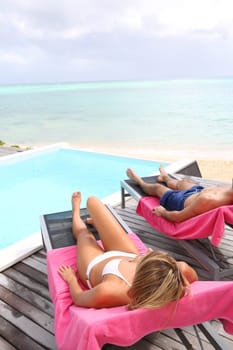 Relaxation time by the pool in Caribe