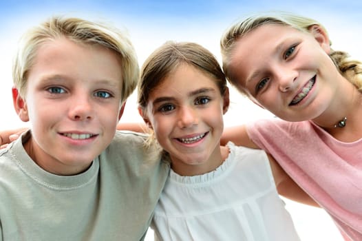 Portrait of kids with arms around each other