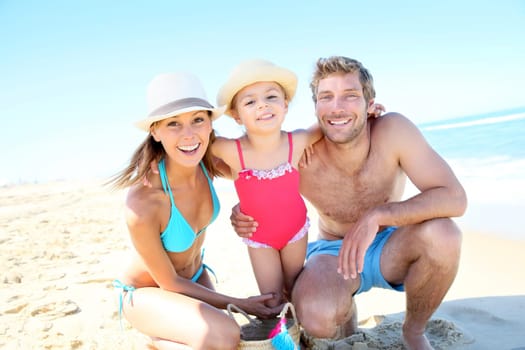 Portrait of happy family at the beach
