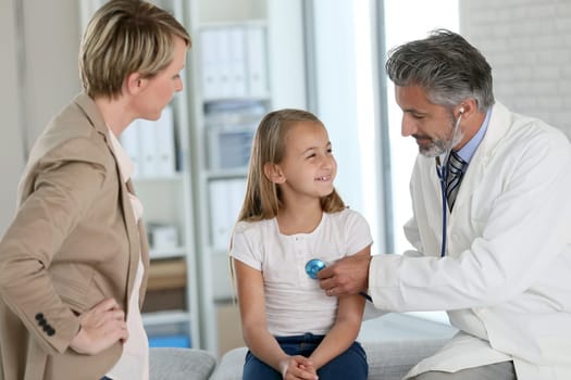 Little girl at doctor's office with mommy