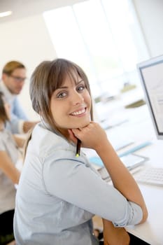 Portrait of young businesswoman working in office