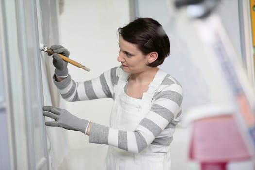 Young woman in professional school to become painter