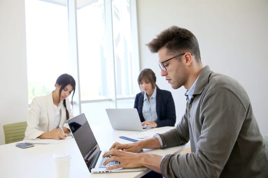 Start-up businesspeople sharing working space