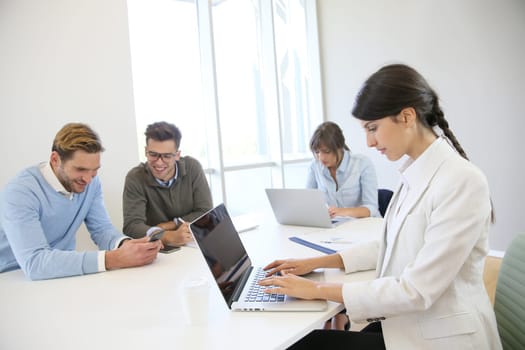 Start-up businesspeople sharing working space