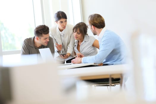 Business people meeting around table