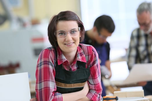Portrait of young woman in carpentry school