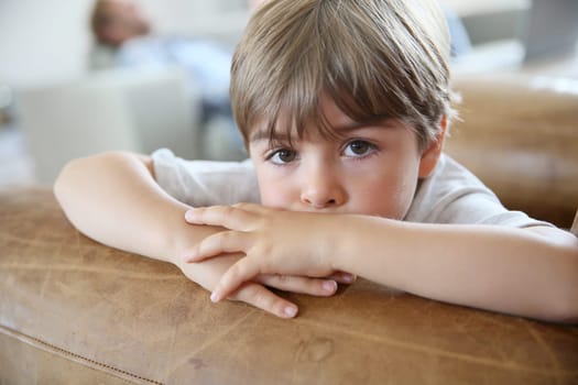 Portrait of cute little boy being thoughtful